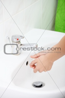 Young woman washing hands