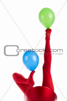 Female feet in red stockings with balloons