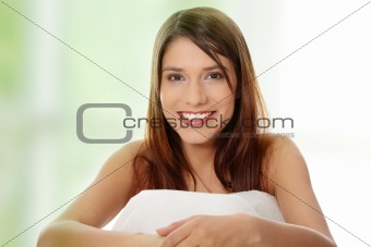 Beautiful young happy caucasian woman in bed