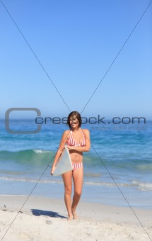 Lovely woman with her surfboard