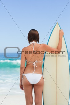 Pretty woman with her surfboard