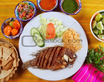 fried mojarra tilapia fish Mexico style with chili sauce