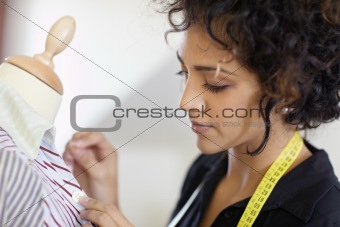 Woman working in fashion design studio