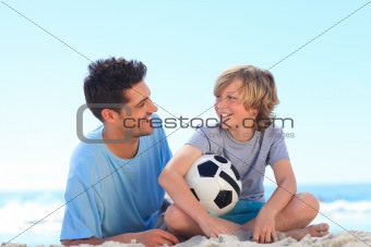 Father and his son with a ball