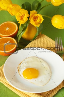 Scrambled eggs and oranges for breakfast