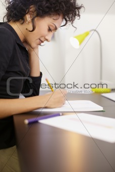 Woman working with sketches in fashion design studio