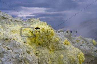 Sulfur crystals around the volcanic hole.
