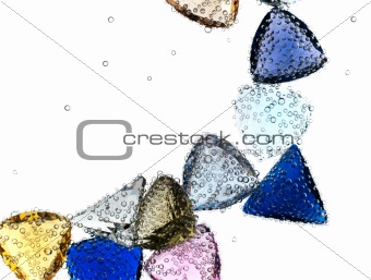 Gems falling in pure water against white.