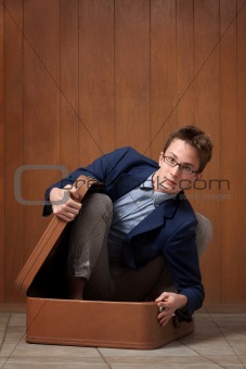 Young Man In Suitcase