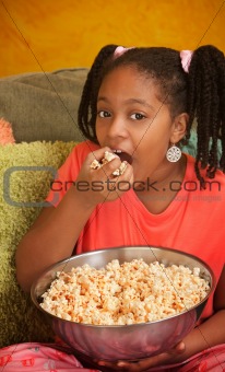 Little Girl Eats Popcorn
