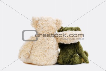Teddy bears holding in one's arms
