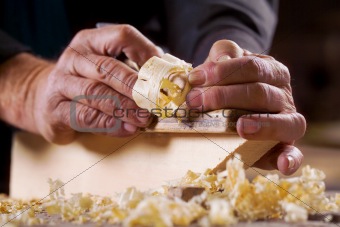 hands working with a tool