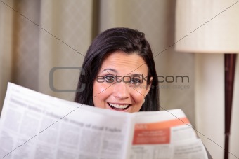 Woman surprised by newspaper