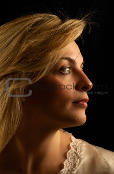 Beautiful young woman looking sideways