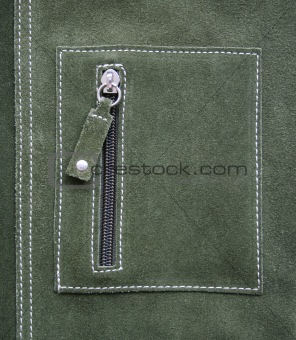 Pocket on green leather texture as background 