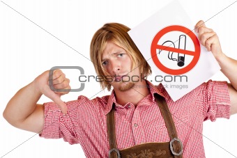 Disapointed Bavarian man in lederhose disagrees to non-smoking-rule
