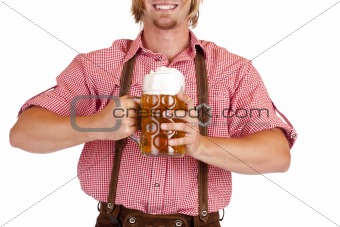 Bavarian man with leather trousers (Lederhose) holds Oktoberfest beer stein