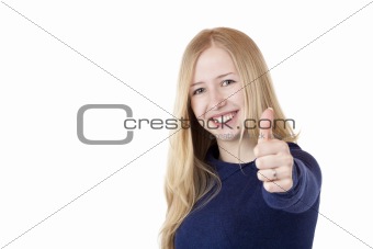 Young beautiful smiling woman shows thumb up