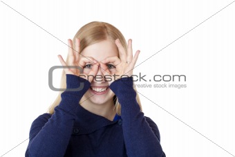 Young attractive woman shows with hands a binoculars