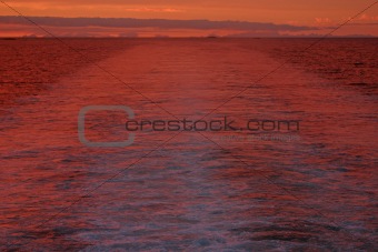 Boat wake and sunset