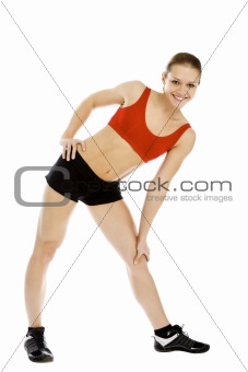 Pretty fitness instructor posing against white background