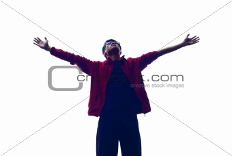 Backlit asian man outstretched arms