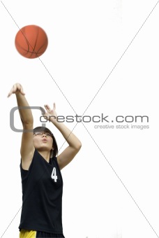 Asian chinese teen girl throw basketball on white 