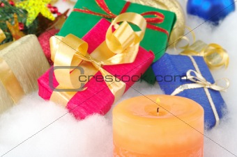 Lit Candle and Presents