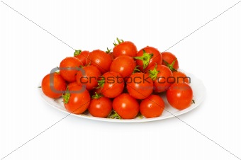 Wet whole tomatos arranged isolated on white