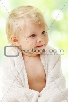 Happy baby with towel