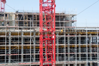 Construction site with crane and building