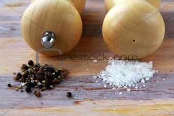 Wooden salt and pepper pot over wooden  background