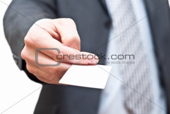 Man in dark suit giving an empty business card