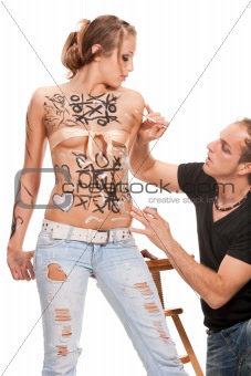 devil boy and  body-painted blonde woman