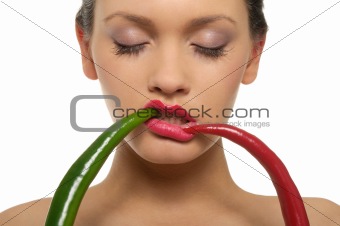 Beautiful woman with red and green peppers