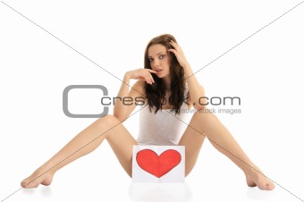 woman sitting on the floor with painted hearts