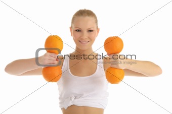 woman engaged in fitness dumbbells of oranges