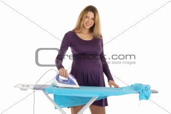 pregnant woman in a purple dress with an iron
