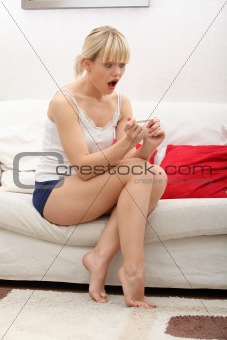 Woman with pregnancy test. 