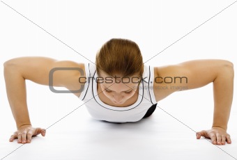 Woman doing pushups on white floor