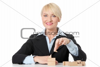 Mature businesswoman with blocks.