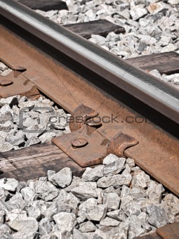 Railroad track with rusty nails