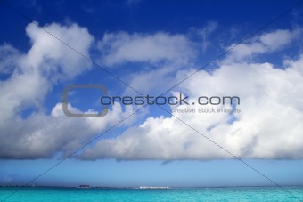 Cumulus clouds over caribbean turquoise sea