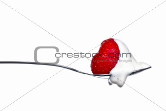 Strawberry and cream on spoon