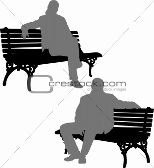 man and woman sitting on the park bench