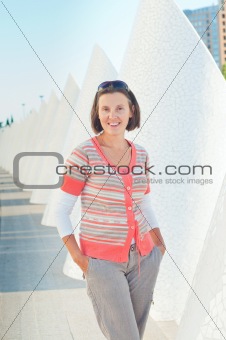 A young woman walking of modern building