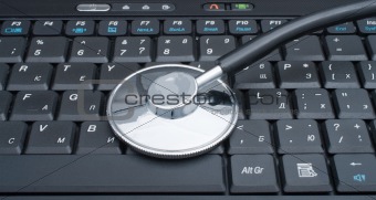  Stethoscope laying on computer