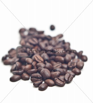 Stack of coffee beans isolated on white