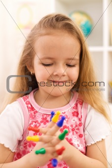 Little girl playing with game pieces