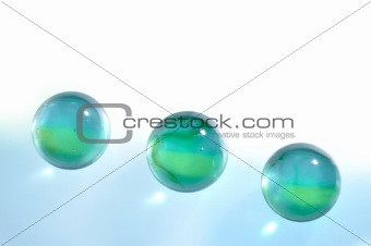 Three glass translucent spheres